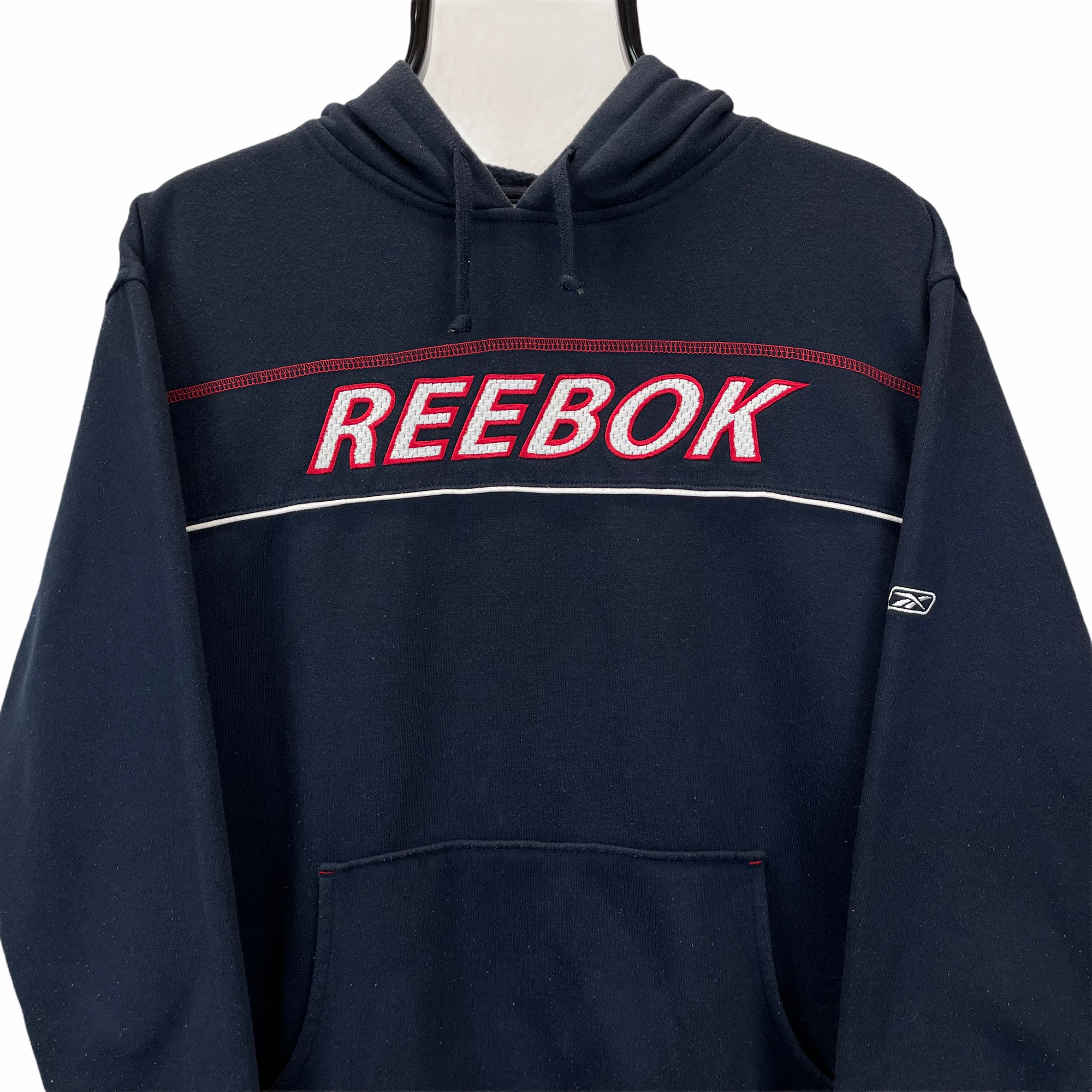 VINTAGE REEBOK SPELLOUT HOODIE IN NAVY - MEN'S MEDIUM/WOMEN'S LARGE