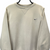 VINTAGE NIKE EMBROIDERED SMALL SWOOSH SWEATSHIRT IN BEIGE - MEN'S MEDIUM/WOMEN'S LARGE